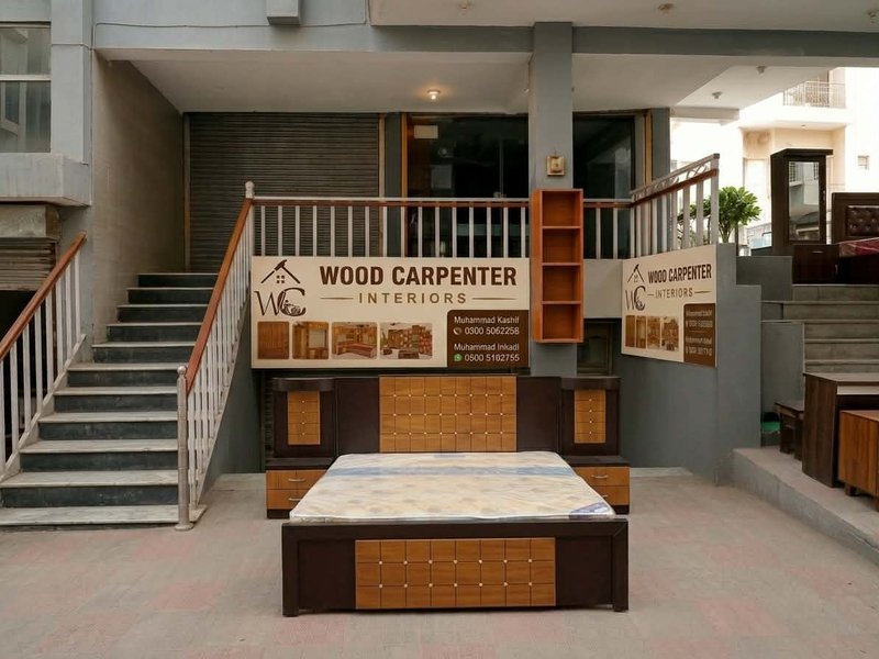 Bed frame with marble-effect headboard on display at showroom