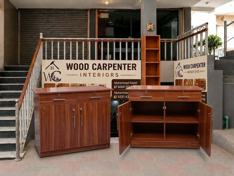 Walnut-finish TV unit and cabinet on display at Wood Carpenter Interiors showroom